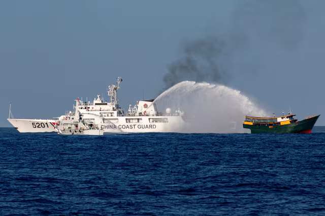 Chinese Ships Fire Water Cannons at Philippine Vessel in Disputed South China Sea Waters